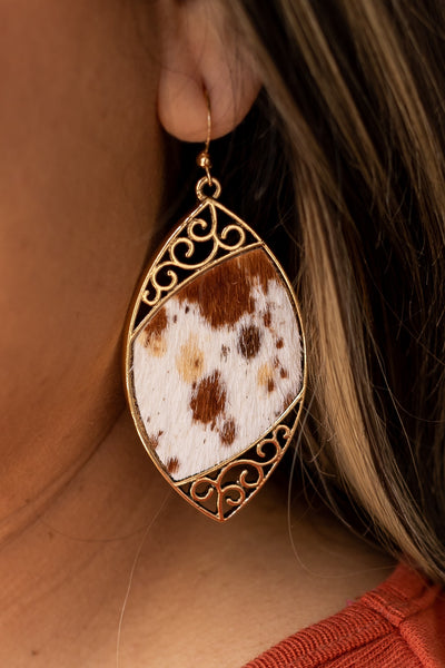 Cowhide Serenade: Gilded Gold Scroll Earrings with a Twist