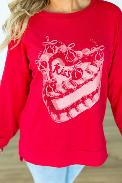 Kiss Cake on Red Sweatshirt