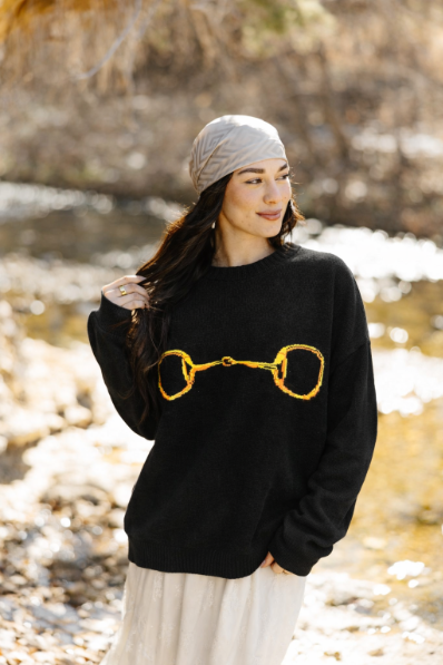 Gold Horse-Bit on a Black Sweater