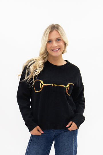 Gold Horse-Bit on a Black Sweater