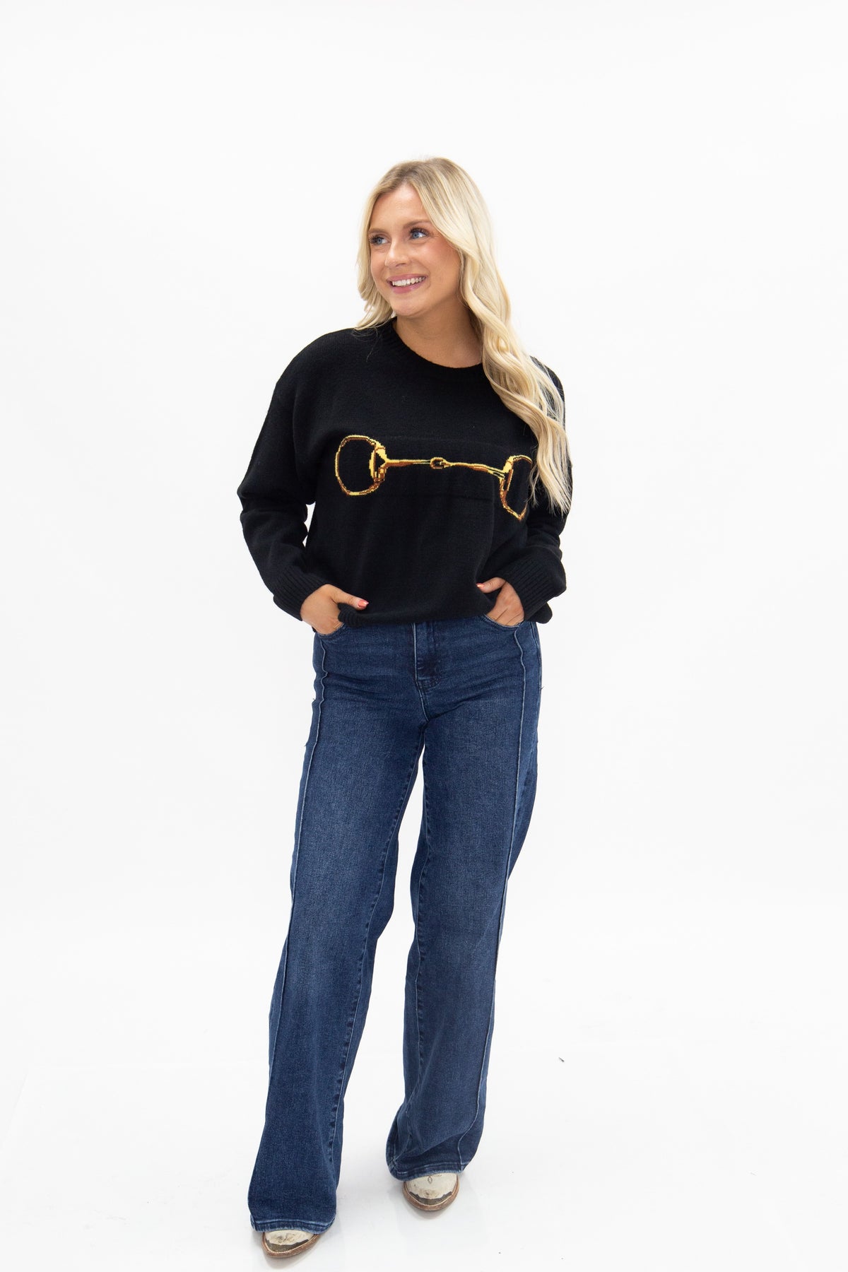 Gold Horse-Bit on a Black Sweater