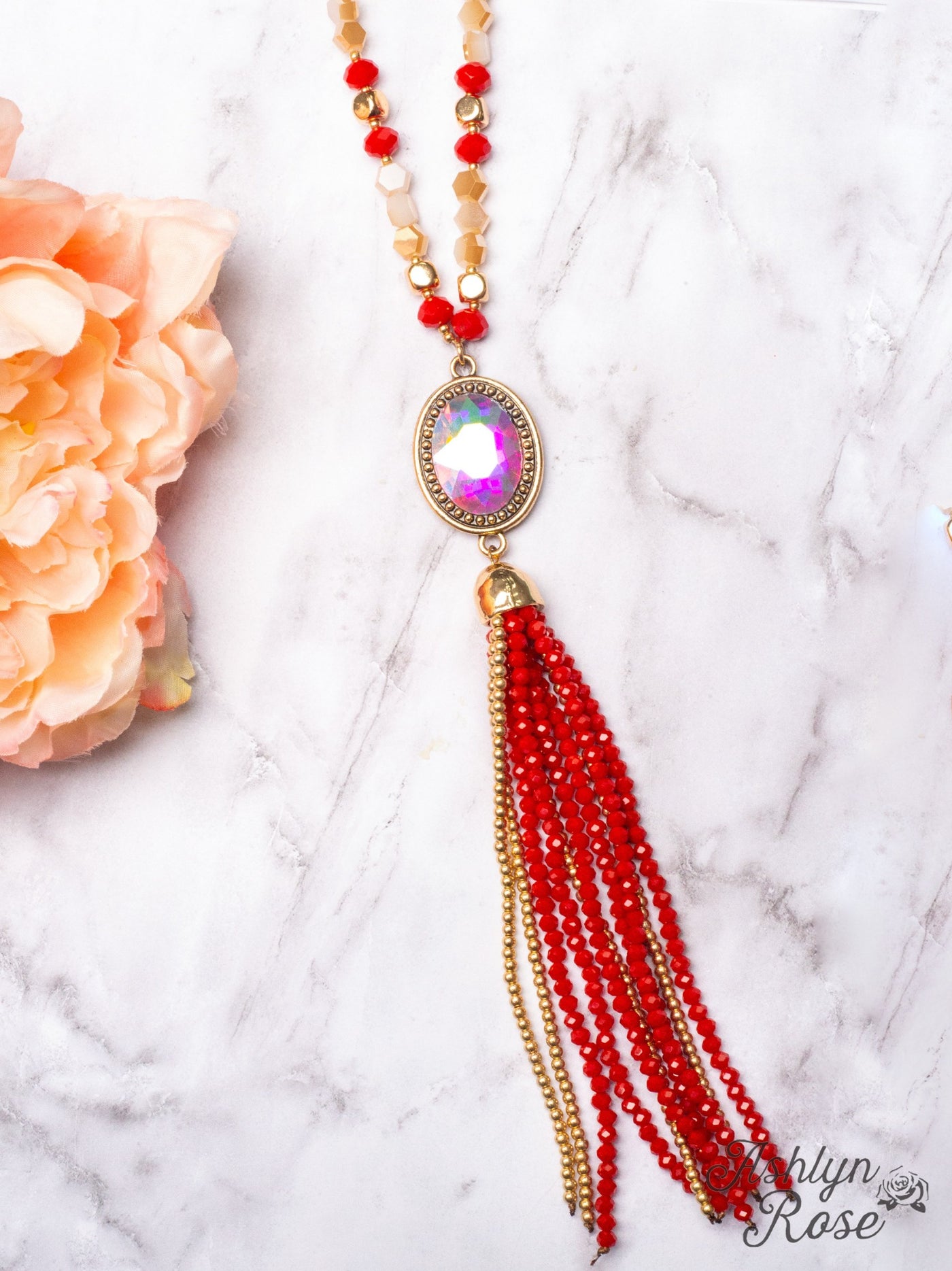 CRASH MY PARTY OVAL IRIDESCENT CRYSTAL BEADED TASSEL PENDANT ON A CRYSTAL BEADED GOLD LINKED CHAIN NECKLACE, RED