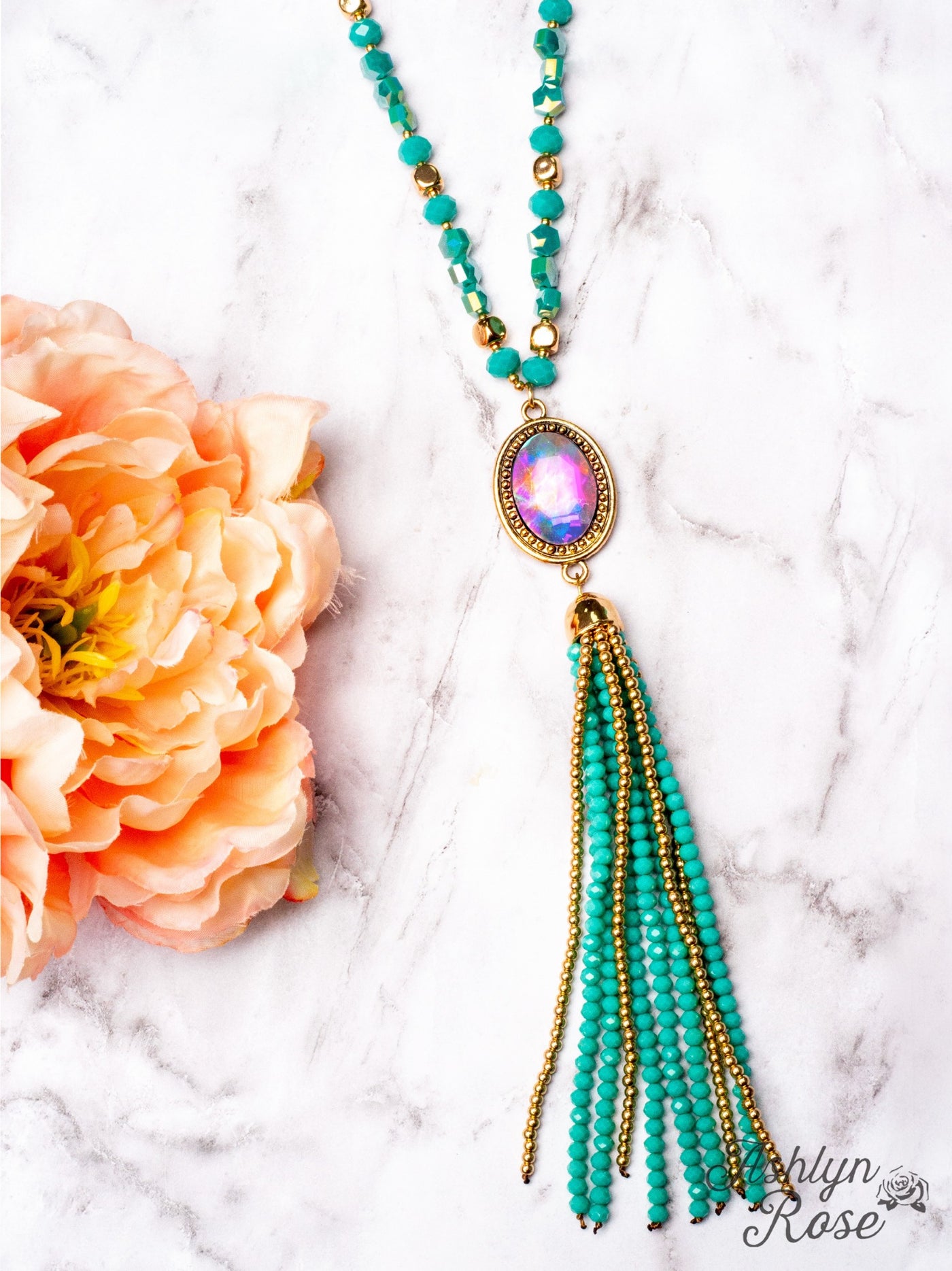 CRASH MY PARTY OVAL IRIDESCENT CRYSTAL BEADED TASSEL PENDANT ON A CRYSTAL BEADED GOLD LINKED CHAIN NECKLACE, TURQUOISE