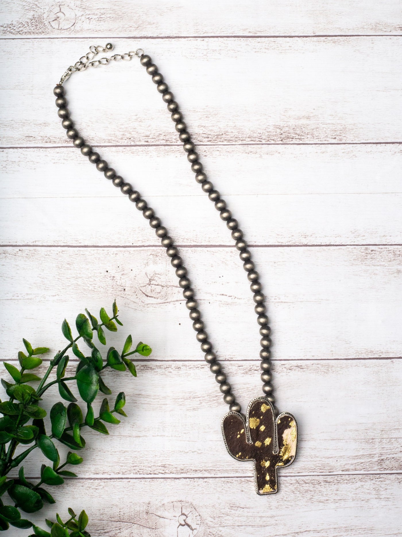 WANTED AND WILD BLACK COWHIDE CACTUS PENDANT ON NAVAJO PEARLS NECKLACE