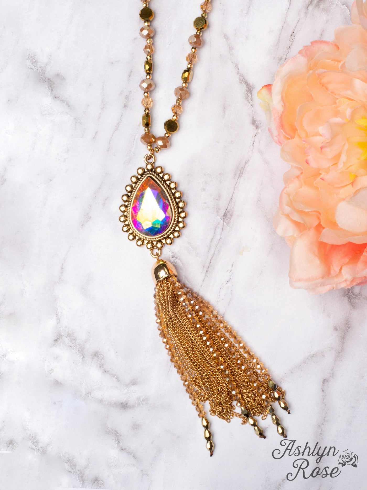 SHINE SO BRIGHT IRIDESCENT OVAL PENDANT GOLD CHAIN TASSEL ON A CRYSTAL BEADED GOLD CHAIN NECKLACE, BROWN