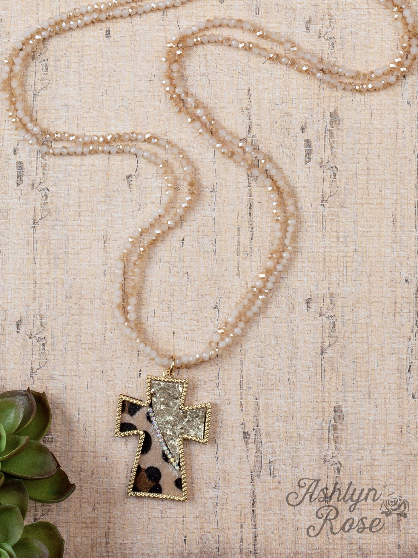 You Can't Cross Me Double Beaded Necklace With A Gold and Sequence Leopard Hide Cross Pendant, Beige